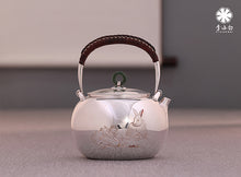 Load image into Gallery viewer, The work of Mr. Li Fuming, a national intangible cultural heritage inheritor, is "9999 pure silver, handmade, carved rabbit welcoming spring, pure silver teapot/Gong Dao Bei/kettle"
