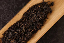 Load image into Gallery viewer, Tongxinshe Teahouse Collection Recommendation: Dayi 2003 Flower Label Panda Tuocha – A Time-Honored Impression of Menghai Old Tea