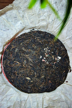 Load image into Gallery viewer, Explore the Charm of Time: Tasting the Grade B Green Seal Pu-erh Raw Tea from the 1990s