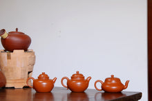 Load image into Gallery viewer, Tongxinshe Tea House cooperates with Mr. Xu Linfeng, a national arts and crafts artist, to bring you 3 fully handmade Zhou Pi Zhu Ni small purple clay teapots with a capacity of 110ml.