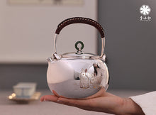 Load image into Gallery viewer, The work of Mr. Li Fuming, a national intangible cultural heritage inheritor, is "9999 pure silver, handmade, carved rabbit welcoming spring, pure silver teapot/Gong Dao Bei/kettle"