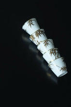 Load image into Gallery viewer, Tongxin She Teahouse Selection | Creamy White Gilded Bamboo Teacups Snow-white porcelain adorned with bamboo painted in gilded pigment.
A gilded rim encircles the cup, freezing tranquil time upon the vessel.