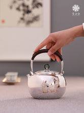 Load image into Gallery viewer, The work of Mr. Li Fuming, a national intangible cultural heritage inheritor, is "9999 pure silver, handmade, carved rabbit welcoming spring, pure silver teapot/Gong Dao Bei/kettle"