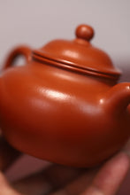 Load image into Gallery viewer, The Chinese Yixing purple clay teapot "Zhou Pi Zhu Ni Lotus Seed Teapot" is completely handmade.
