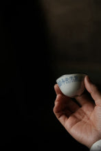 Load image into Gallery viewer, Tongxin She Teahouse · Tea Ware Selection Blue and White Eggshell Cup with Silver Rim & Seal Script Calligraphy A Soul-Stirring Literati Teacup, the Perfect Companion for Gongfu Tea.