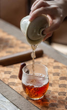 Load image into Gallery viewer, The 2022 Wuyi Rock Tea "Hu Xiao Yan Rou Gui" is made using traditional craftsmanship.