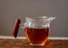 Load image into Gallery viewer, The 2022 Wuyi Rock Tea "Hu Xiao Yan Rou Gui" is made using traditional craftsmanship.