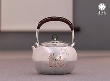 Load image into Gallery viewer, The work of Mr. Li Fuming, a national intangible cultural heritage inheritor, is "9999 pure silver, handmade, carved rabbit welcoming spring, pure silver teapot/Gong Dao Bei/kettle"