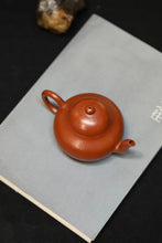 Load image into Gallery viewer, Fully handmade "Old Zhu Ni Small Flat Pear Purple Clay Pot" with a capacity of 110ml.