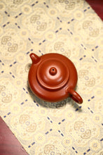 Load image into Gallery viewer, The Chinese Yixing purple clay teapot "Zhou Pi Zhu Ni Lotus Seed Teapot" is completely handmade.