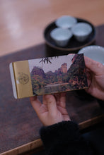 Load image into Gallery viewer, Treasured at Tongxinshe Teahouse: A Brew of 1998 Jiuqu Rou Gui Rock Tea