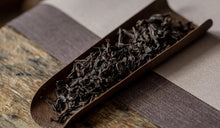 Load image into Gallery viewer, The 2022 Wuyi Rock Tea "Hu Xiao Yan Rou Gui" is made using traditional craftsmanship.