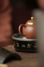 Load image into Gallery viewer, "Black Glazed and Gold-traced Tripod Tea Saucer: An Exquisite Choice on the Tea Table"