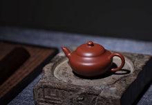 Load image into Gallery viewer, A collection-level handmade purple clay teapot, made by Master Hui Xiangyun, the 15th generation descendant of Hui Mengchen, the "Rare Da Hong Pao Zhu Ni Han Zhu  Teapot" with a capacity of 100cc.