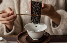 Load image into Gallery viewer, The 2022 Wuyi Rock Tea "Hu Xiao Yan Rou Gui" is made using traditional craftsmanship.