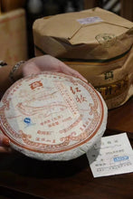 Load image into Gallery viewer, Menghai Tea Factory Dayi 701 Hongzhuang Raw Pu'er Tea: The Flavor and Value of Years of Aging