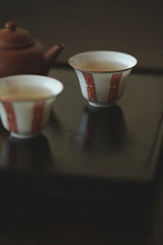 Load image into Gallery viewer, "Alum Red Longevity Character Pattern Ruoshen Cup: The Integration of Elegance and Ingenuity"