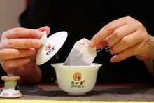 Load image into Gallery viewer, Chinese tea in the 1990s, auspicious sales method of teabags, and exported Pu'er Shu tea. Box 50g