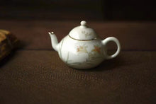 Load image into Gallery viewer, Pottery Meng Chen small teapot with silver mouth spout, elegant and playful, with smooth water flow and delicate hand-painted patterns.