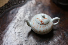 Load image into Gallery viewer, Pottery Meng Chen small teapot with silver mouth spout, elegant and playful, with smooth water flow and delicate hand-painted patterns.