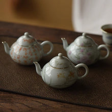 Load image into Gallery viewer, Pottery Meng Chen small teapot with silver mouth spout, elegant and playful, with smooth water flow and delicate hand-painted patterns.