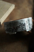 Load image into Gallery viewer, Ink-colored Landscape Copper-top Tea Boat Tongxinshe Teahouse Recommendation A tea session, with mountains and rivers captured on the vessel. 墨彩山水铜面茶船/壶承
