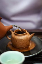 Load image into Gallery viewer, Tasting in Tongxin She Teahouse: Encountering the Timeless Secrets of the 1940 Antique Pu&#39;er Tea
