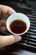 Load image into Gallery viewer, Tasting in Tongxin She Teahouse: Encountering the Timeless Secrets of the 1940 Antique Pu&#39;er Tea
