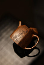 Load image into Gallery viewer, A Treasured Purple Clay Vessel, A Wonderful Realm of Zen Tea——Appreciation of the Hexagonal Qinquan Teapot with Engraving of Patriarch Bodhidharma in Tongxinshe Teahouse Collection
