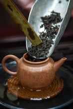 Load image into Gallery viewer, Tasting in Tongxin She Teahouse: Encountering the Timeless Secrets of the 1940 Antique Pu&#39;er Tea
