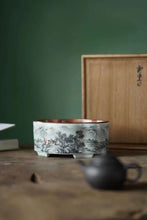 Load image into Gallery viewer, Ink-colored Landscape Copper-top Tea Boat Tongxinshe Teahouse Recommendation A tea session, with mountains and rivers captured on the vessel. 墨彩山水铜面茶船/壶承
