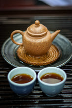 Load image into Gallery viewer, Tasting in Tongxin She Teahouse: Encountering the Timeless Secrets of the 1940 Antique Pu&#39;er Tea
