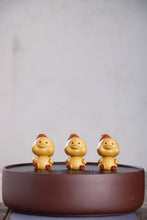 Load image into Gallery viewer, Purple Clay Tea Pets: Christmas Ducklings
