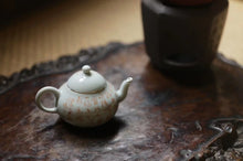 Load image into Gallery viewer, Pottery Meng Chen small teapot with silver mouth spout, elegant and playful, with smooth water flow and delicate hand-painted patterns.
