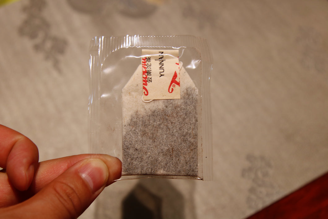 Chinese tea in the 1990s, auspicious sales method of teabags, and exported Pu'er Shu tea.  Box 50g
